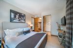 Primary suite w/ king bed, attached, lavish bathroom with steam shower and/or soaker tub